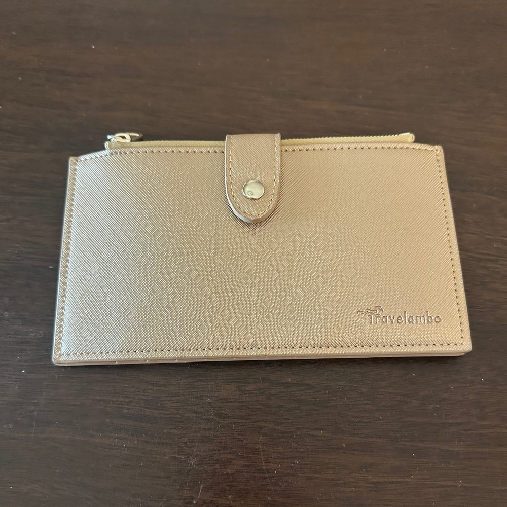 Travelambo Woman’s Wallet in Gold Color. Like New